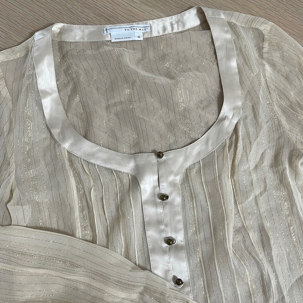 Sheer blouse with gold details